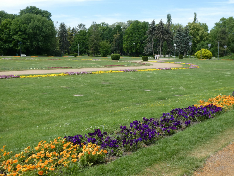 Formal gardens, playing fields, and a concert area with staging being disassembled after yesterday's big event.