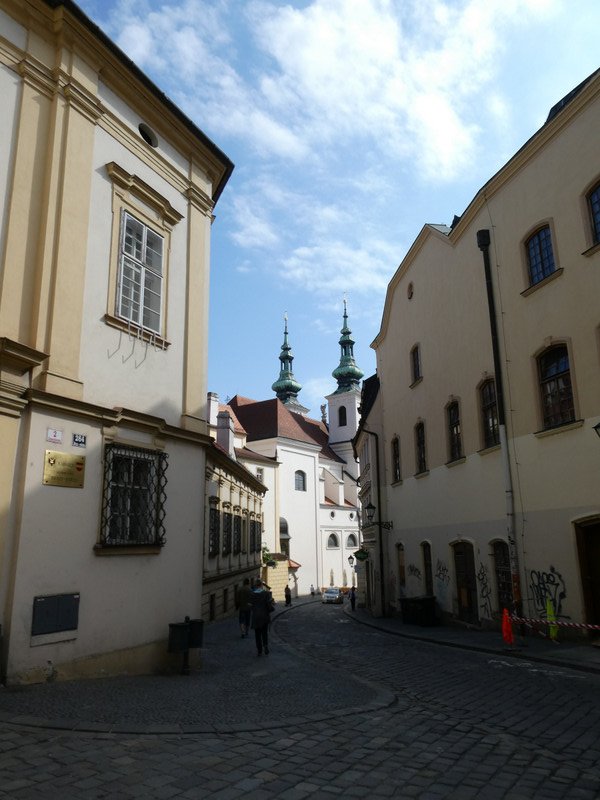 Narrow cobblestone streets and ornate buildings