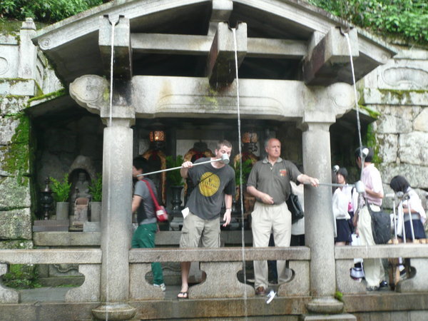 Drinking the water from Otowa-no-Taki (Otowa Falls) at Kiyomizudera