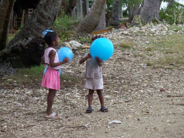 Haitian girls playing with balloons we brought.