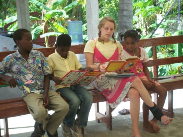 Rachel enriching some kids lives by reading to them.