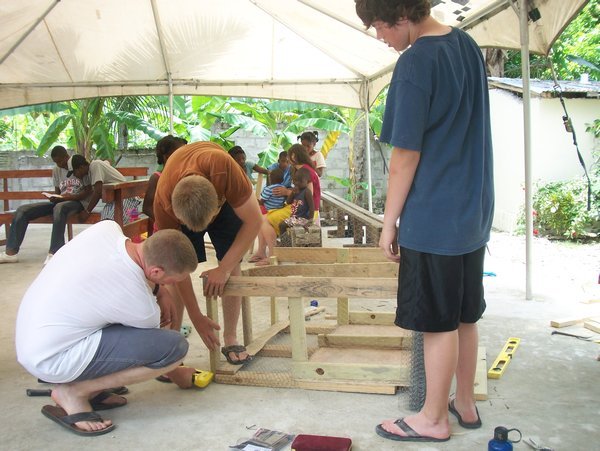 Nathan, Erik, and Peter working on the rabbit cage.