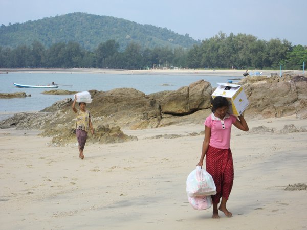 Local people carrying supplies from the boat