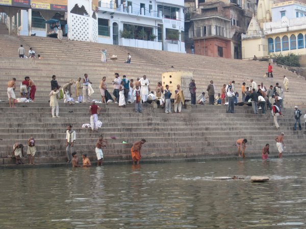 People washing themselves in the river