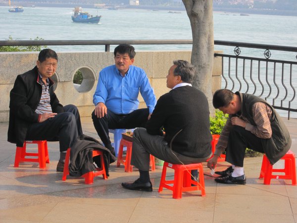 Local Chinese men playing cards in the park