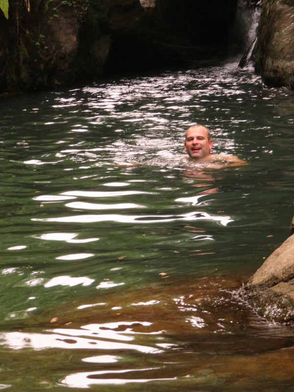 Kyle Swimming to Waterfall