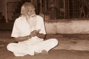 An Old Resident Claps to the Puja Beat