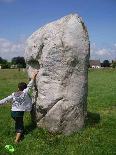 W.. climbing Avebury stone