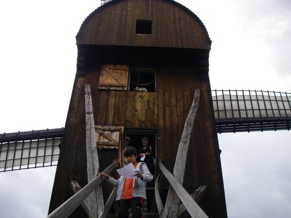 W.. climbing down windmill