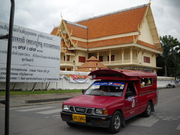 Red Taxis, Wats, and Thai Signs
