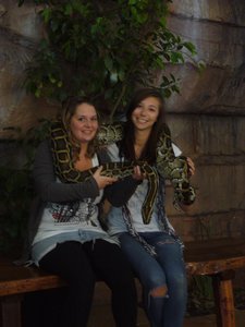 the girls holding a Burmese python