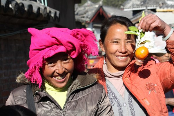 Happy Naxi woman by the market.