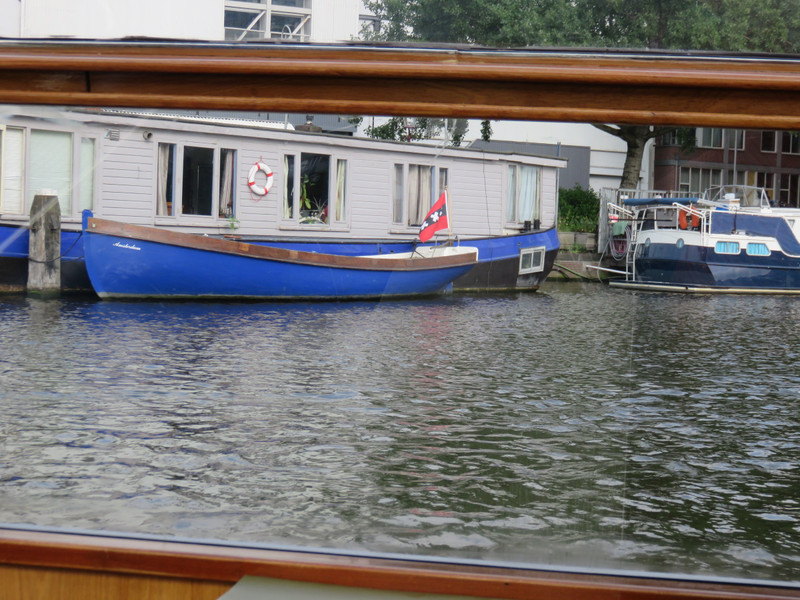 Houseboat in canal in town.