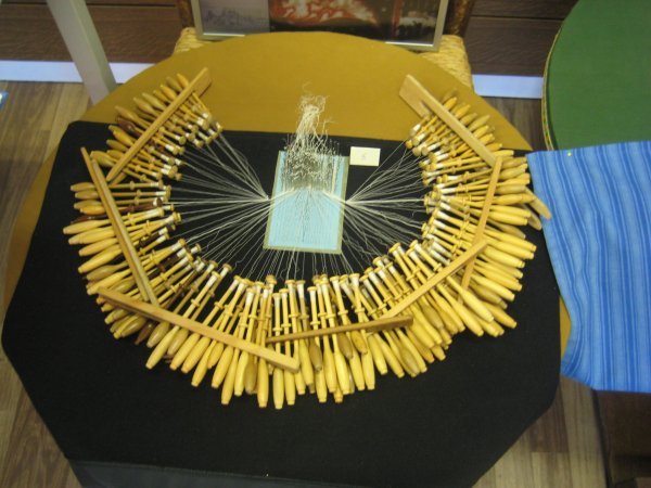 Display of the bobbins required to make a small peice of lace