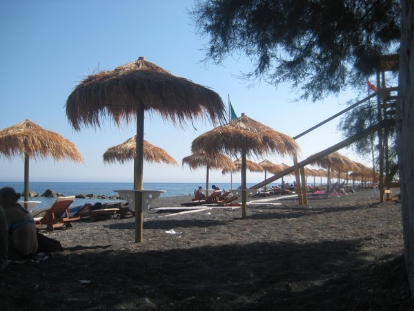 Grass umbrellas on Perissa beach