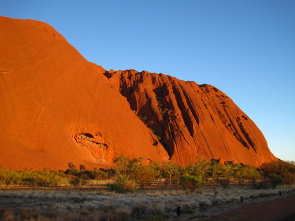 A very red Uluru around sunset