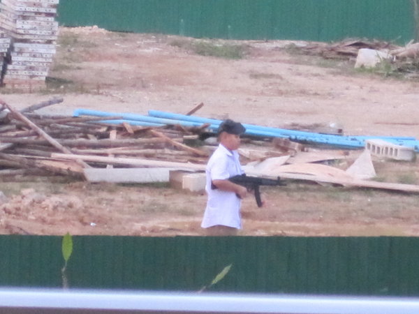 Kid with an AK47 in the backyard of our hotel! 