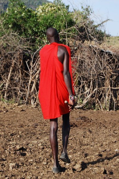 following our guide at the Masai village
