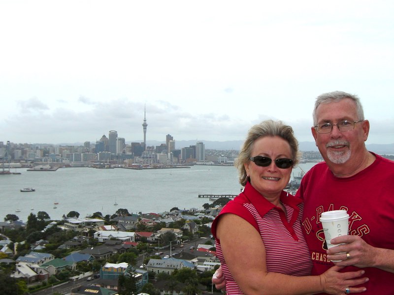 mom and dad with auckland behind them