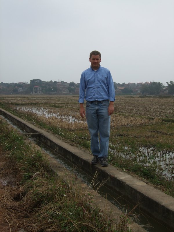 Jason walking along irrigation canal