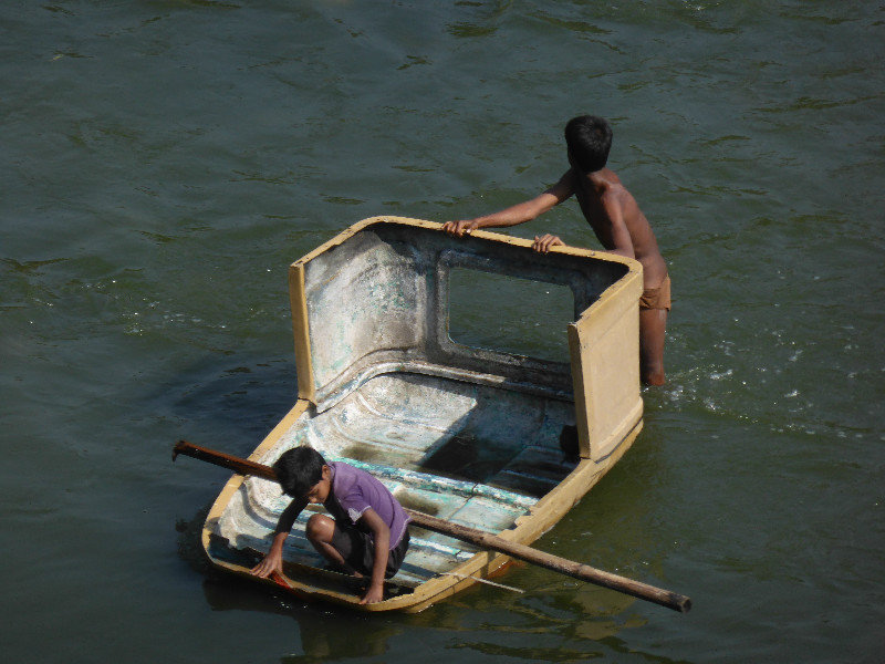 Boys in home made boat
