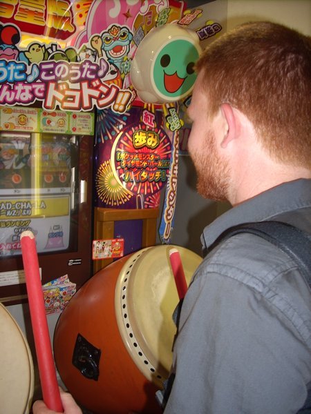 John playing at the arcade