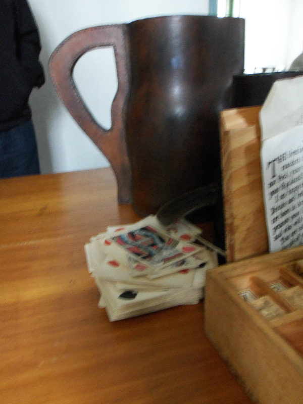 A Leather Pitcher for Beer and Old Playing Cards