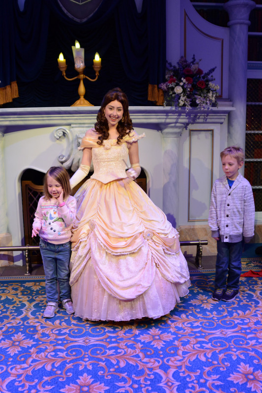 The kids with Belle and Lumiere