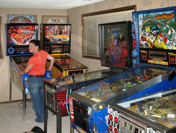Rebecca racks up yet another free game on one of the 14 machines in David's (Dan's brother) basement