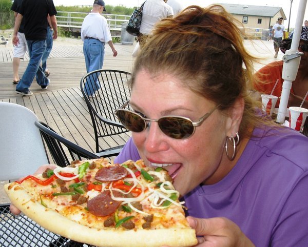 Noshing on pizza at the Atlantic City boardwalk