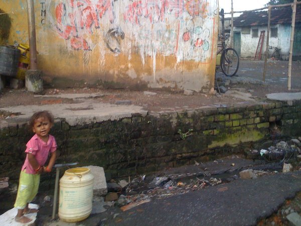 Kid playing in slum in Calcutta