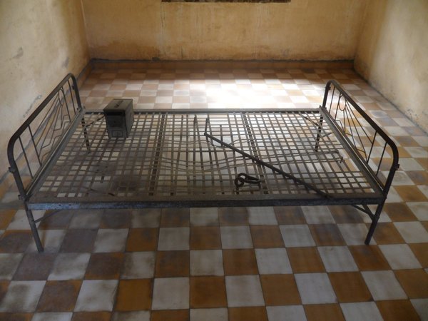 Bed where prisoners were chained and tortured