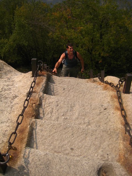 Joel climbing up the rockface.