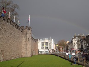 Cardiff Castle wall with distant rainbow