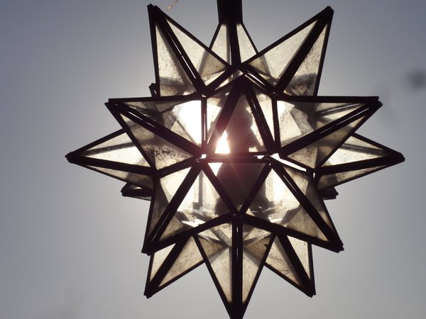 The sun shining through a star lantern