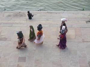 Woman walking down the ganges