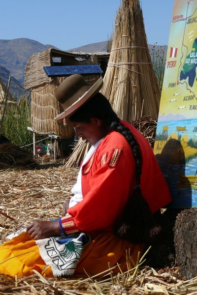 Lady weaving on the reed island