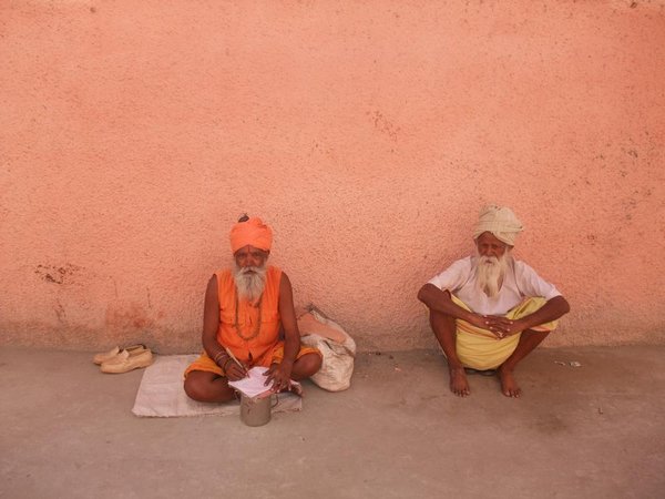 Two Sadhus begging at the side of the road
