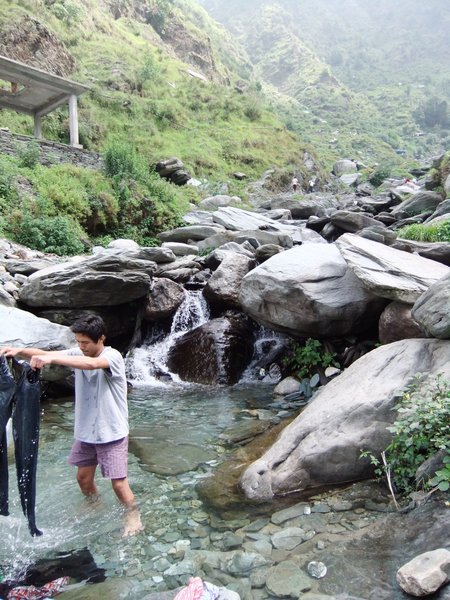 Washing our clothes in the river