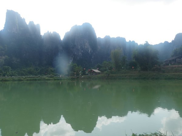 Mountains reflected in the fish farm lakes