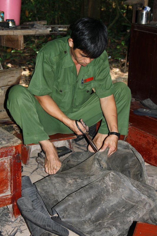 Man making shoes out of tyres as they did for the army.