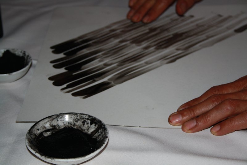 Finger painting with vodka and ink