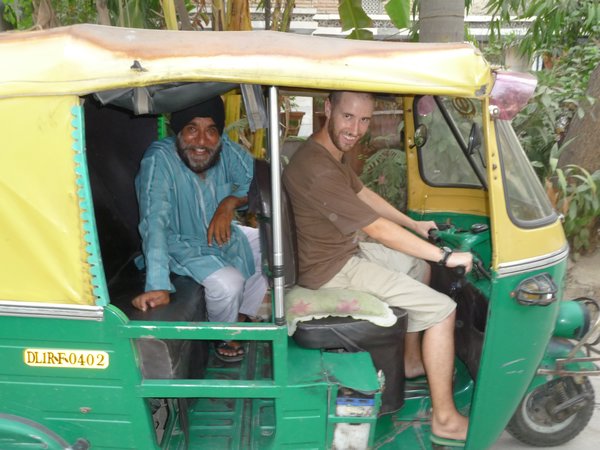 Niall Showing Our Rickshaw Driver, Radu, How to Drive