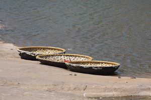 Coracles on the river bank