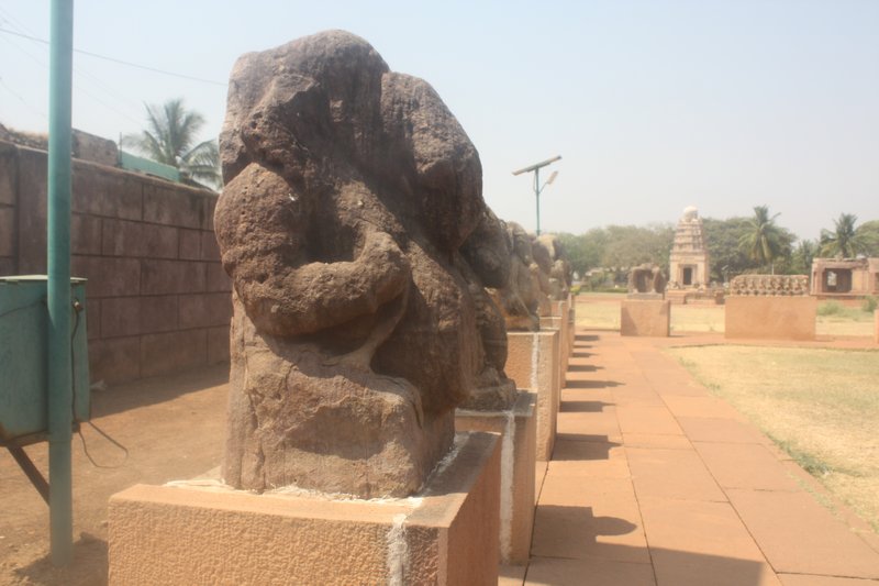 A row of Ganesh statues overlook Pattadakal