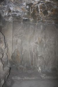 A skeletal kala carved into the wall of Cave 21
