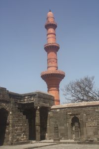 Chand Minar towers over the temple courtyard