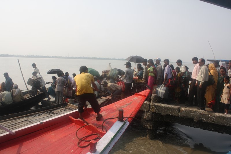 River commuters pile aboard a boat