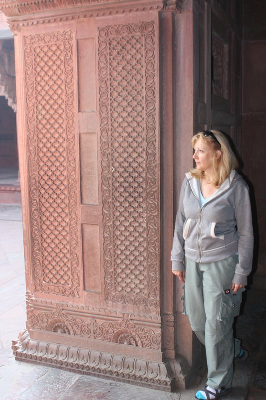 Ruth admiring a stunning carved door frame