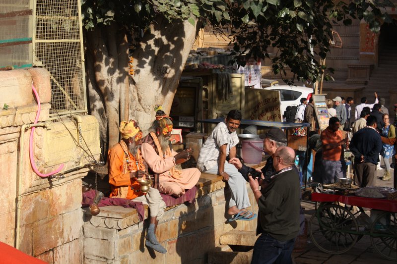 A guru takes up station outside a Jain Temple